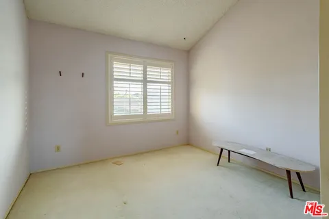 a view of a room with windows