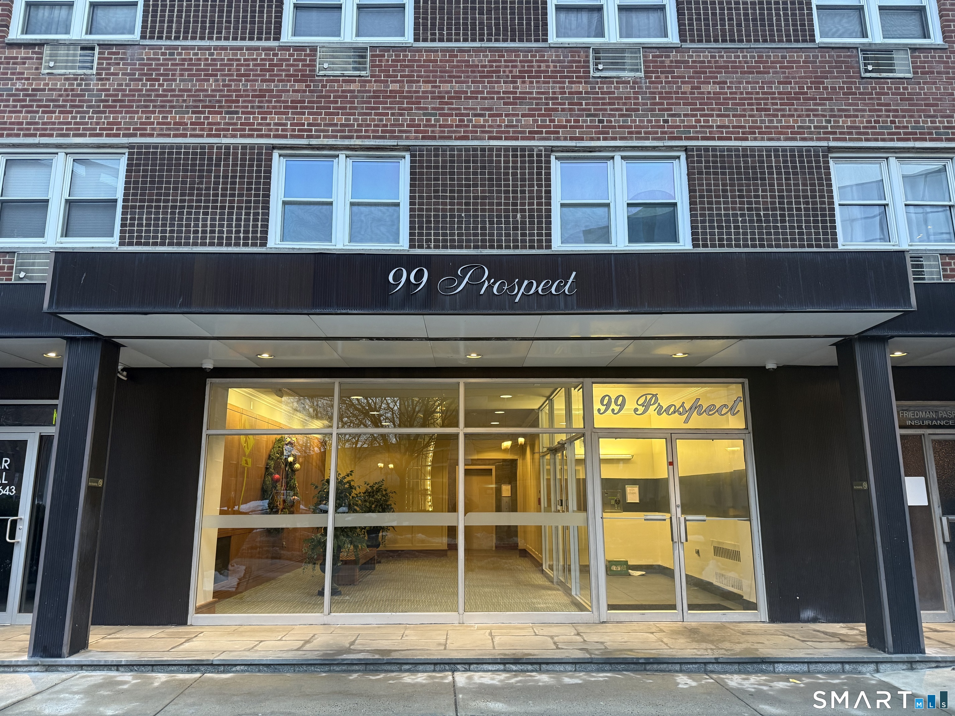 99 Prospect Street, Unit 4D Stamford, CT 06901 - Photo 1 of 1 a front view of a building with a entryway