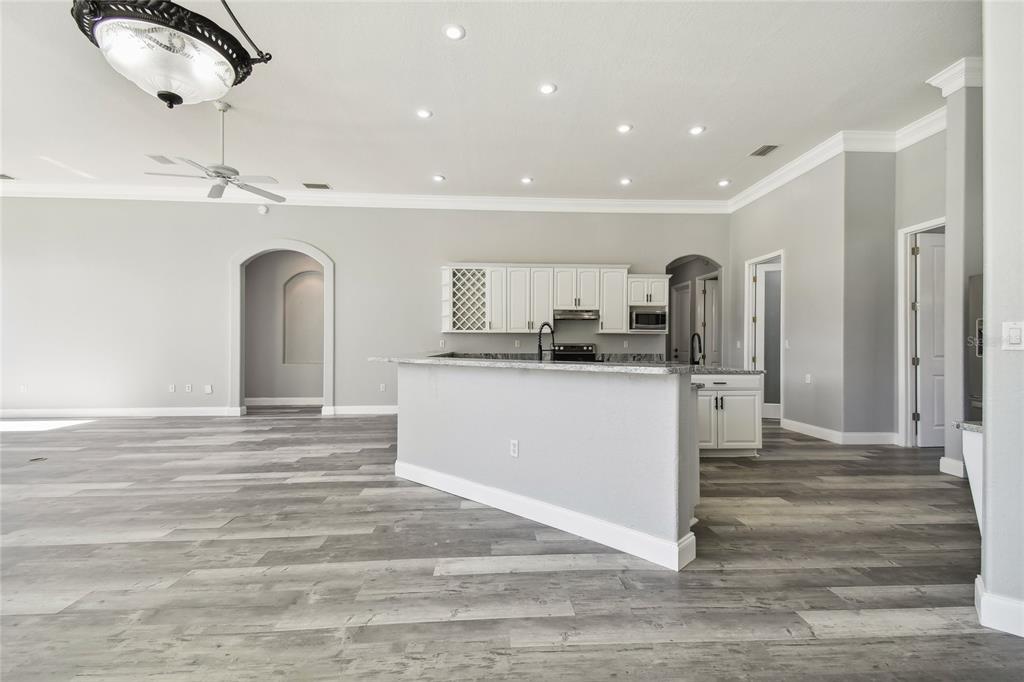 6644 Country Club Road Wesley Chapel, FL 33544 - Photo 15 of 75 a view of a kitchen with a sink and refrigerator