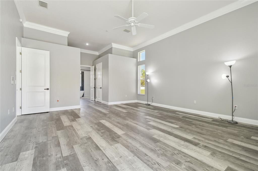 6644 Country Club Road Wesley Chapel, FL 33544 - Photo 23 of 75 a view of an empty room with a ceiling fan