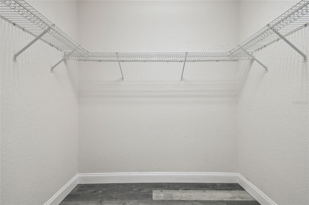 6644 Country Club Road Wesley Chapel, FL 33544 - Photo 34 of 75 a view of a room with racks on the wall