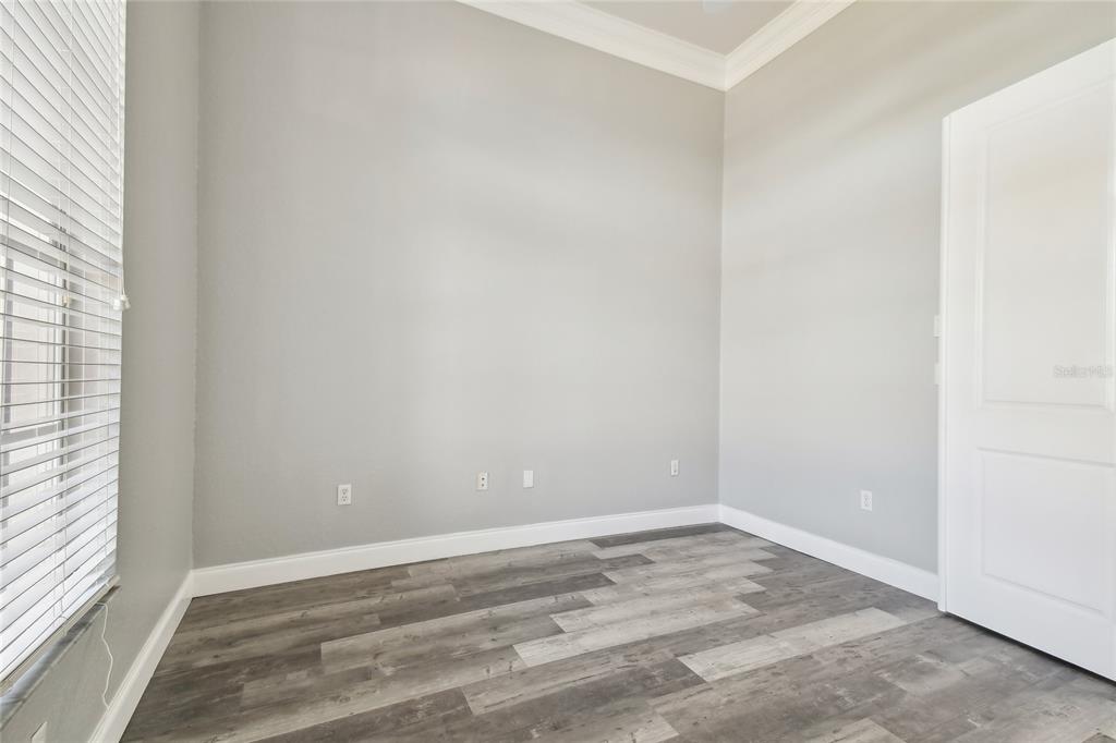 6644 Country Club Road Wesley Chapel, FL 33544 - Photo 37 of 75 an empty room with a window