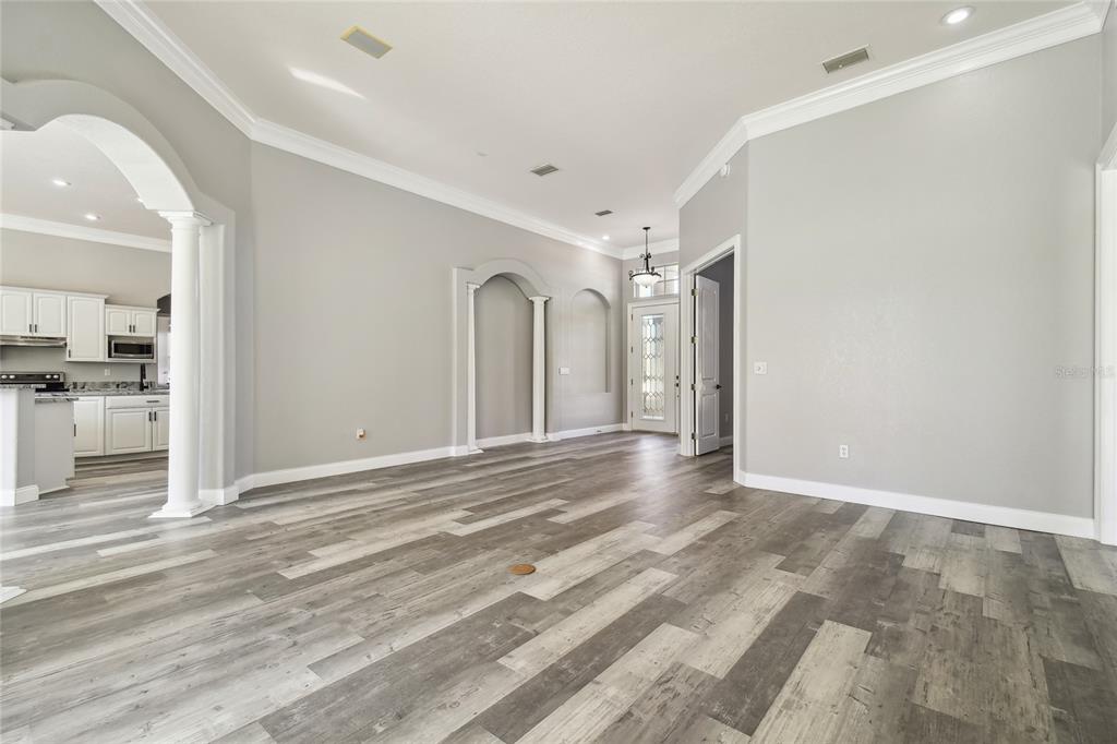 6644 Country Club Road Wesley Chapel, FL 33544 - Photo 4 of 75 a view of a livingroom with wooden floor