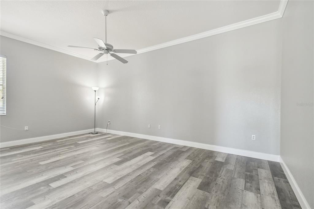 6644 Country Club Road Wesley Chapel, FL 33544 - Photo 48 of 75 a view of an empty room with a window