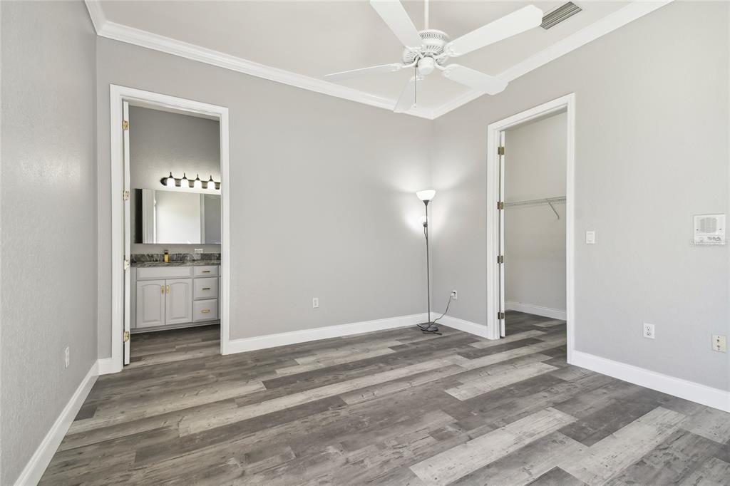 6644 Country Club Road Wesley Chapel, FL 33544 - Photo 56 of 75 a view of a bathroom with a sink and a mirror