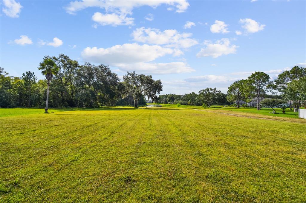 6644 Country Club Road Wesley Chapel, FL 33544 - Photo 70 of 75 a view of a swimming pool and an outdoor space