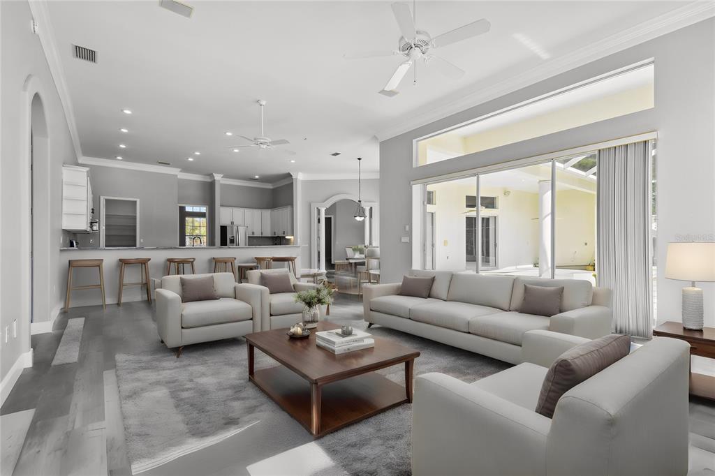 6644 Country Club Road Wesley Chapel, FL 33544 - Photo 7 of 75 a living room with furniture and a large window