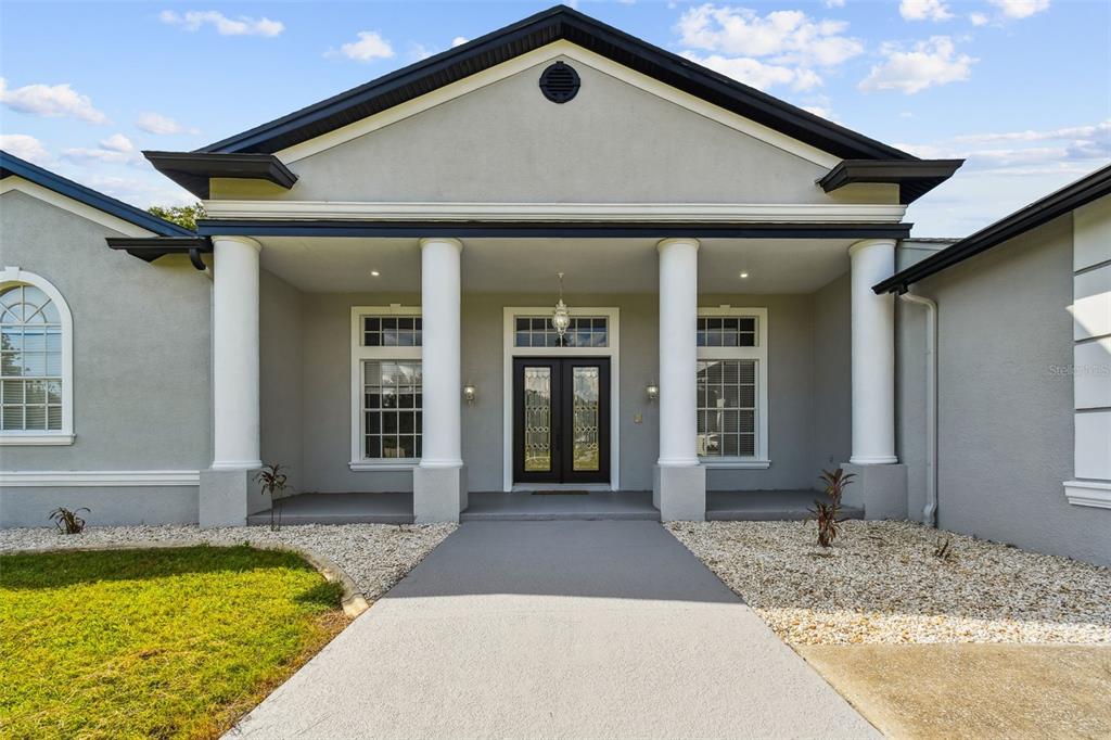 6644 Country Club Road Wesley Chapel, FL 33544 - Photo 75 of 75 a front view of a house with swimming pool