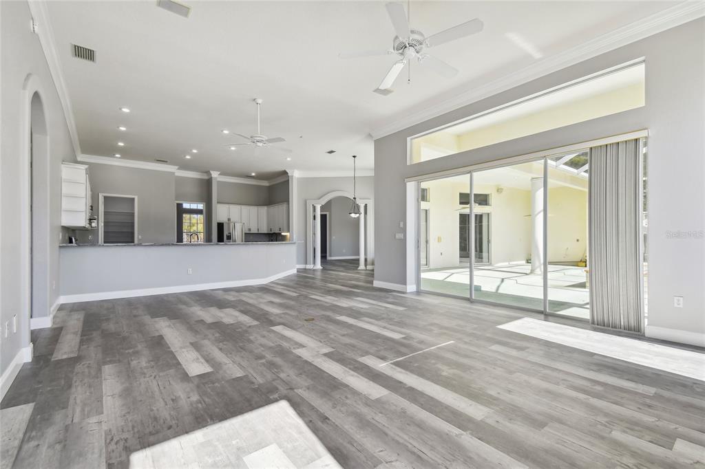 6644 Country Club Road Wesley Chapel, FL 33544 - Photo 8 of 75 a view of a livingroom with a flat screen tv