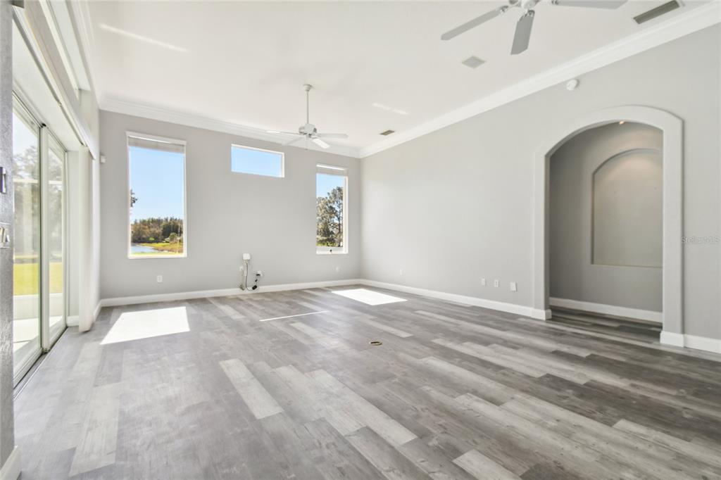 6644 Country Club Road Wesley Chapel, FL 33544 - Photo 10 of 75 a view of empty room with window and ceiling fan