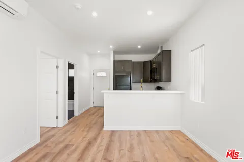 a view of kitchen with wooden floor