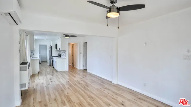a view of a kitchen with a wooden floor