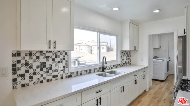 a bathroom with a sink double vanity and a mirror