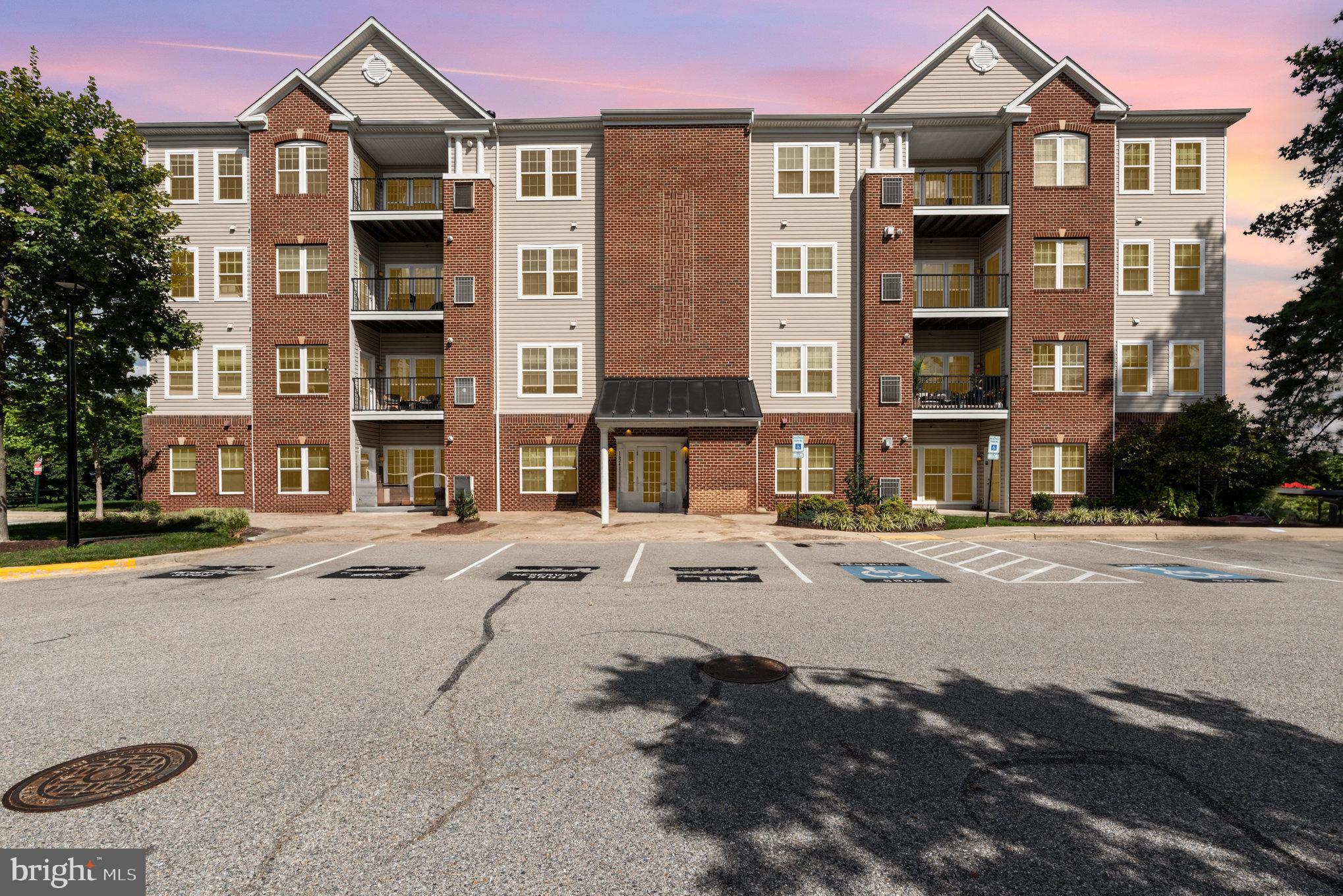1624 Hardwick Court, Unit 402 Hanover, MD 21076 - Photo 1 of 27 a front view of a house with a yard