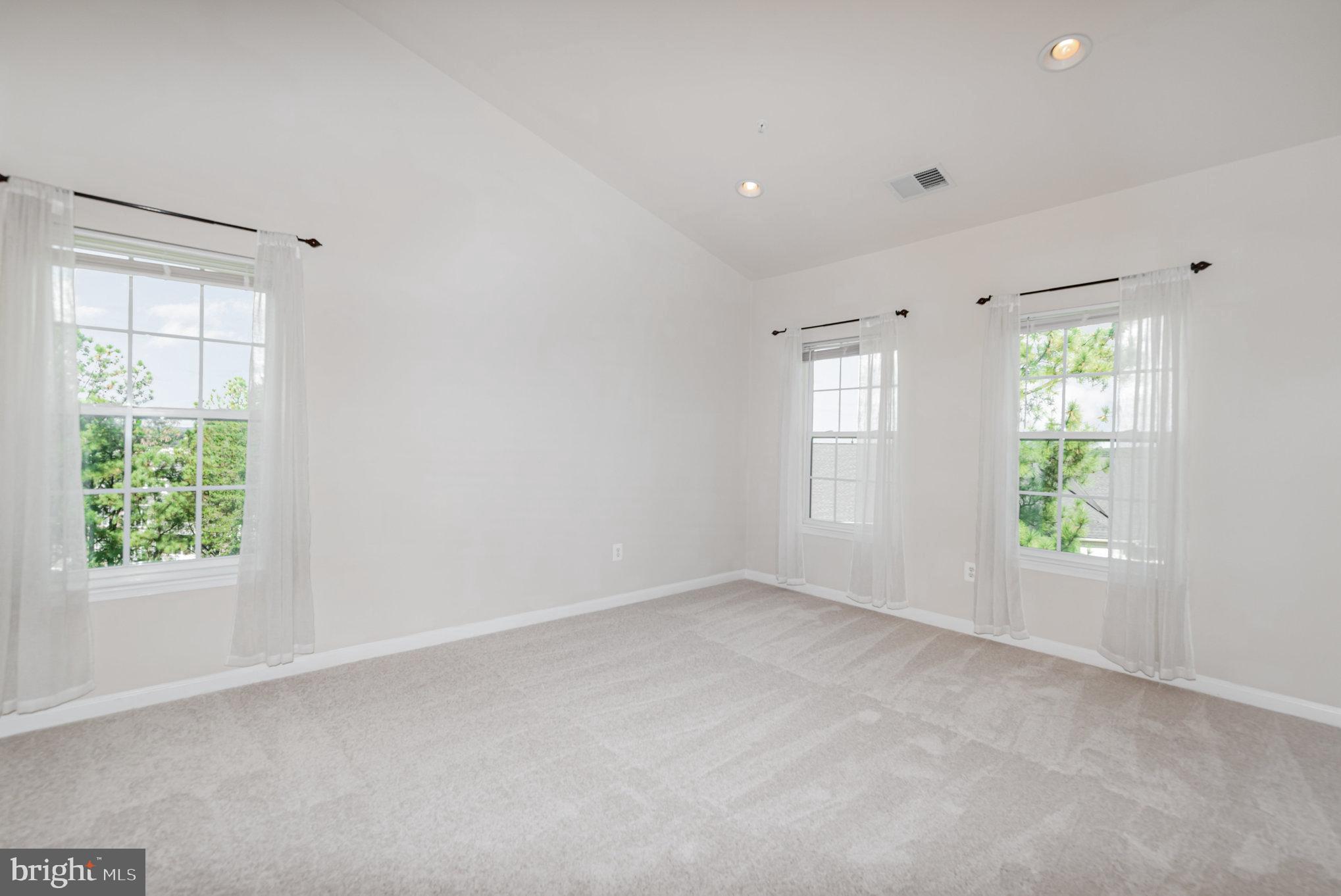 1624 Hardwick Court, Unit 402 Hanover, MD 21076 - Photo 12 of 27 an empty room with windows