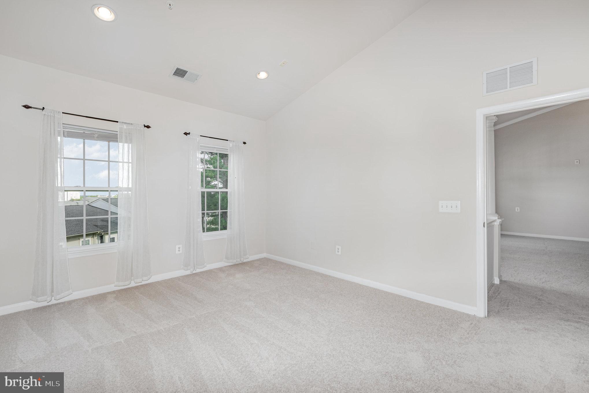 1624 Hardwick Court, Unit 402 Hanover, MD 21076 - Photo 13 of 27 an empty room with windows