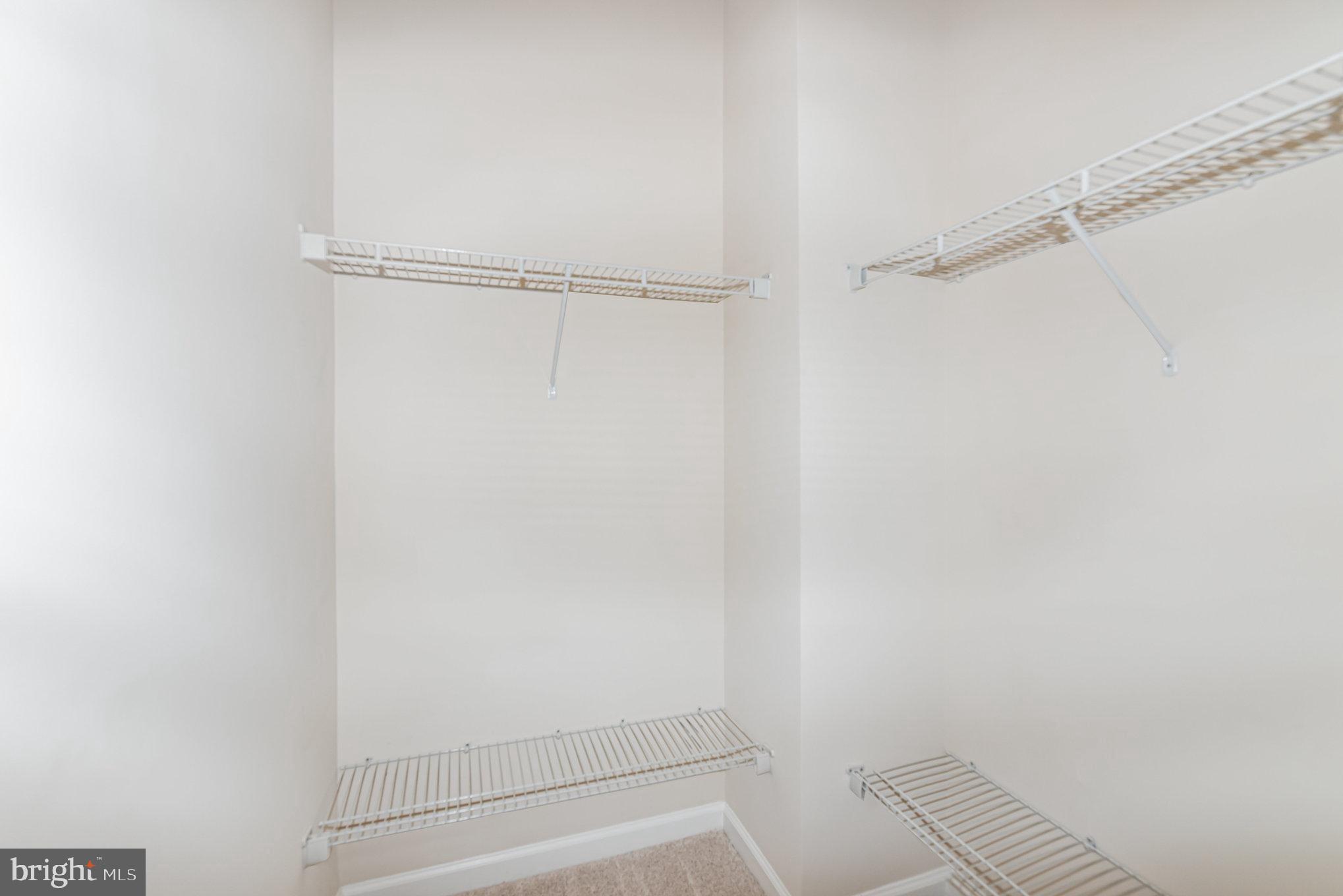 1624 Hardwick Court, Unit 402 Hanover, MD 21076 - Photo 15 of 27 a view of walk in closet with empty racks