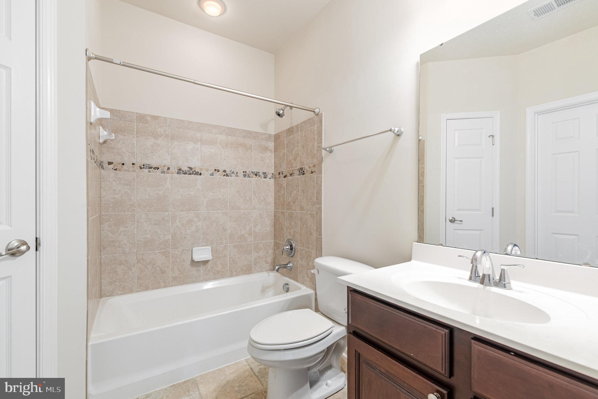 1624 Hardwick Court, Unit 402 Hanover, MD 21076 - Photo 20 of 27 a bathroom with a sink a toilet and a bathtub