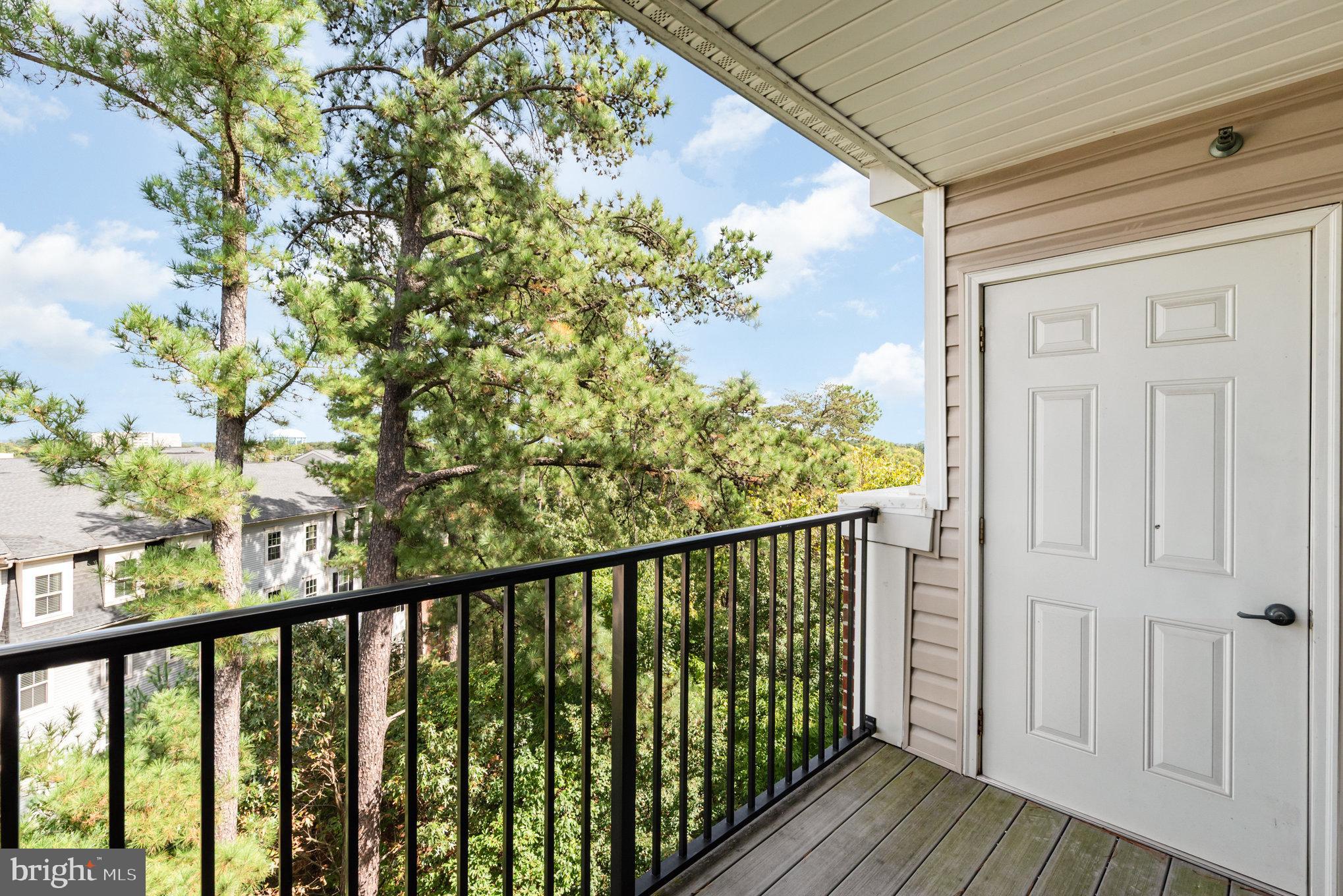 1624 Hardwick Court, Unit 402 Hanover, MD 21076 - Photo 22 of 27 a view of a balcony with wooden floor