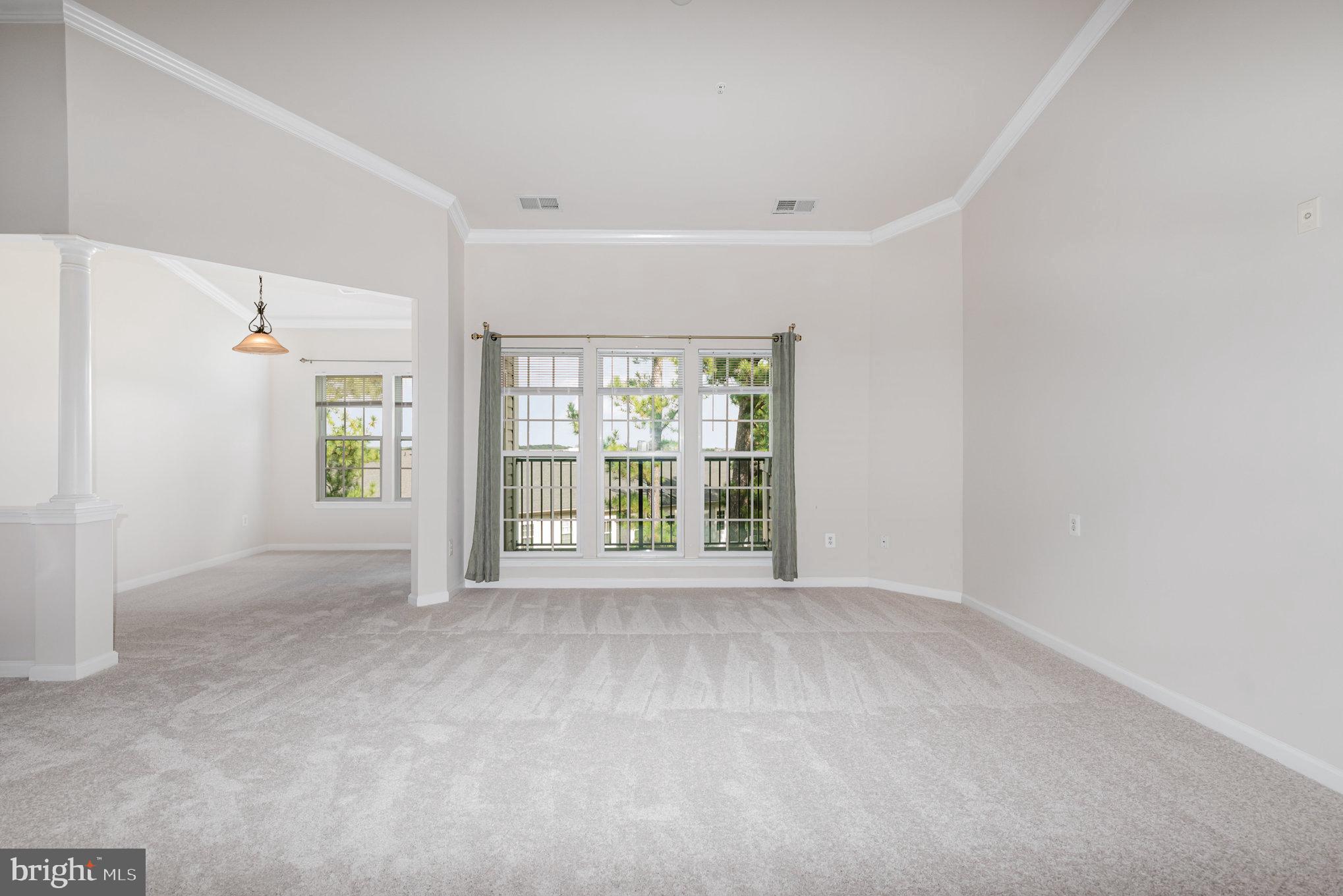 1624 Hardwick Court, Unit 402 Hanover, MD 21076 - Photo 4 of 27 a view of an empty room with a window