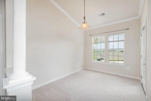 an empty room with a empty space and windows