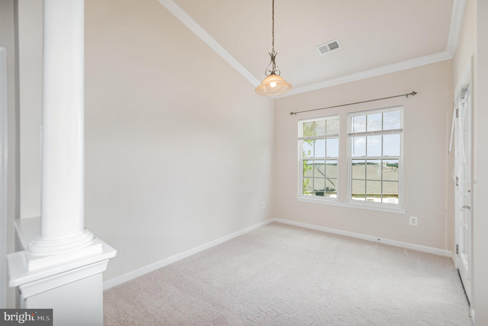 1624 Hardwick Court, Unit 402 Hanover, MD 21076 - Photo 5 of 27 an empty room with a empty space and windows