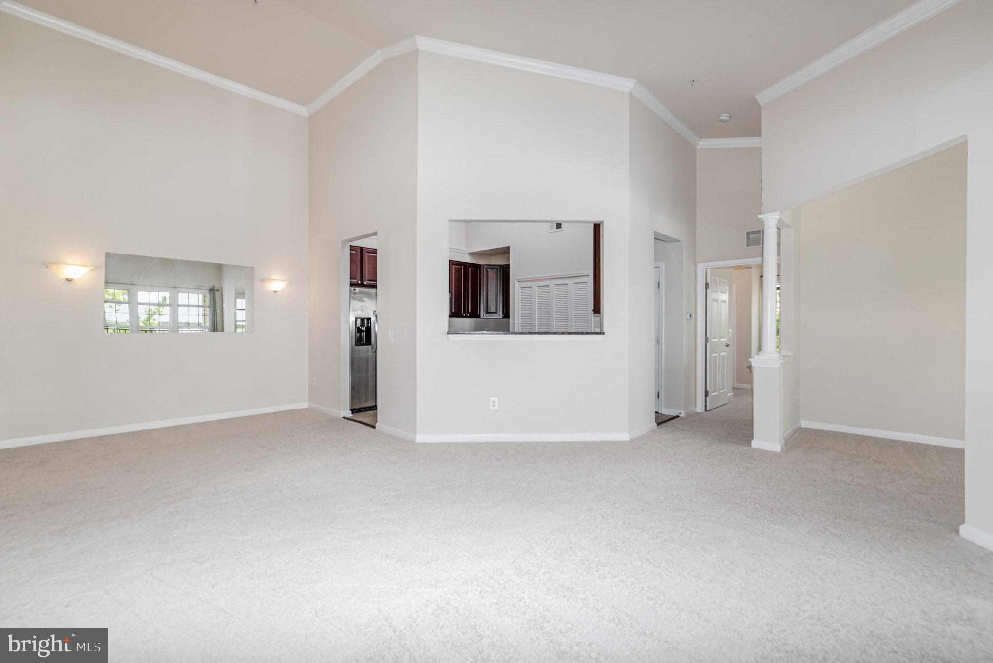 1624 Hardwick Court, Unit 402 Hanover, MD 21076 - Photo 7 of 27 a view of a big room with windows and cabinet