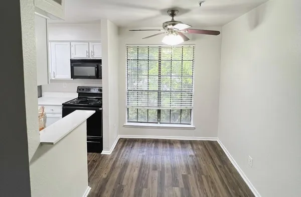 a kitchen with a sink and a refrigerator