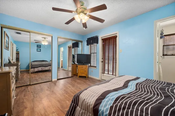 a bedroom with a bed and a couch