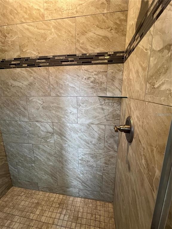 11 Ullock Place, Unit A Palm Coast, FL 32164 - Photo 7 of 10 a bathroom with a shower