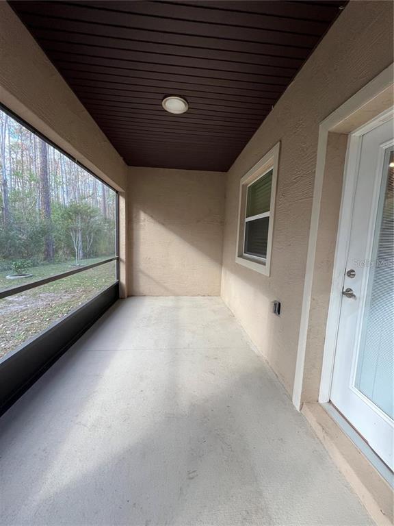 11 Ullock Place, Unit A Palm Coast, FL 32164 - Photo 9 of 10 a view of empty room with large window