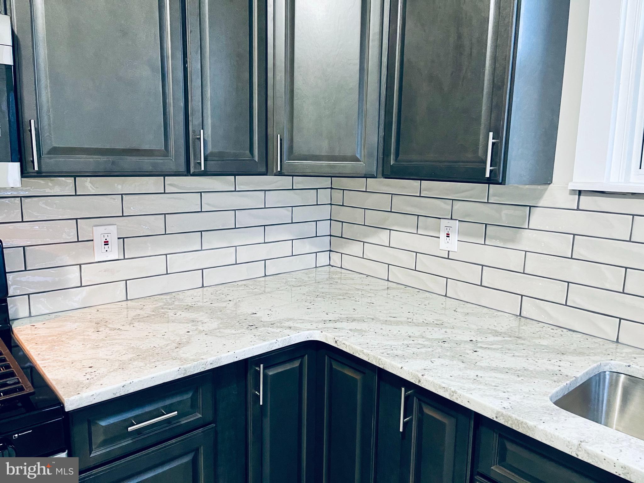 304 Haig Boulevard Reading, PA 19607 - Photo 14 of 27 a kitchen with a sink and cabinets