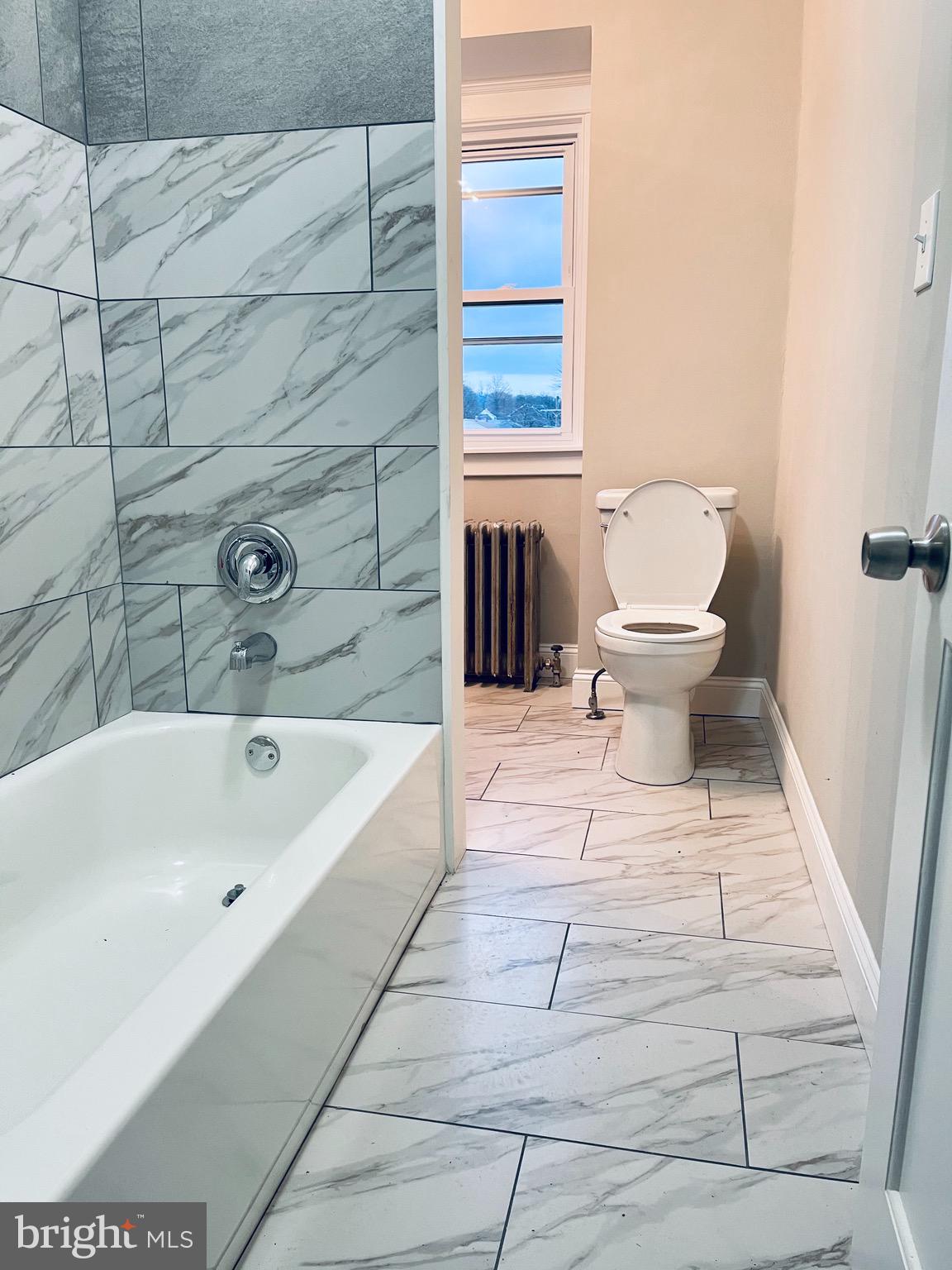 304 Haig Boulevard Reading, PA 19607 - Photo 23 of 27 a bathroom with a sink and a bathtub