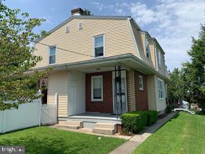 304 Haig Boulevard Reading, PA 19607 - Photo 4 of 27 a front view of a house with a yard and garage