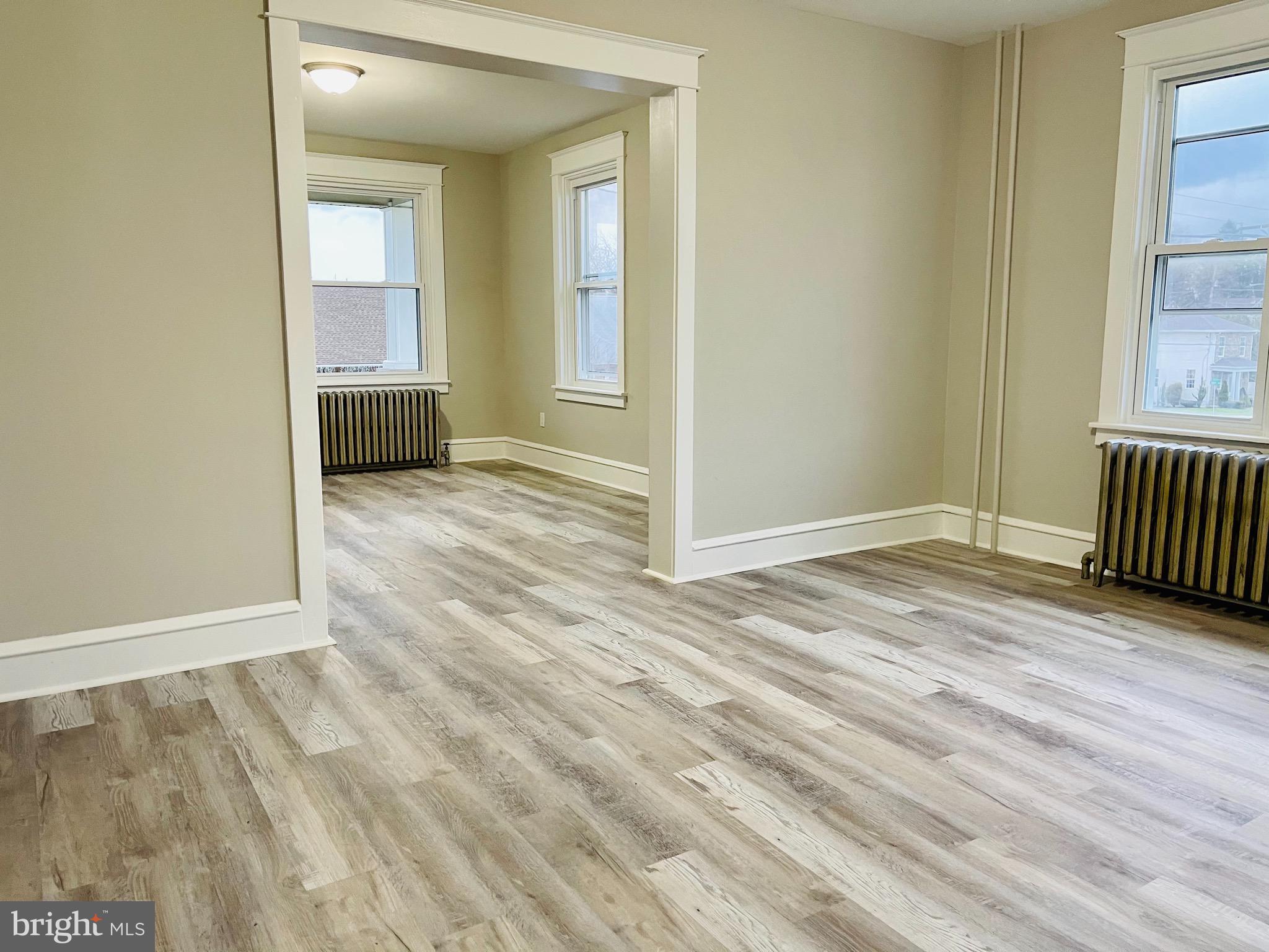 304 Haig Boulevard Reading, PA 19607 - Photo 10 of 27 an empty room with wooden floor and windows
