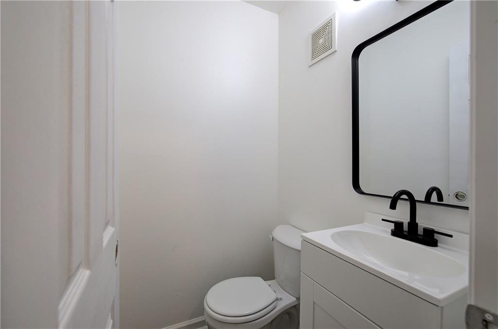22 Nottingham Drive Northwest Cartersville, GA 30121 - Photo 17 of 36 a bathroom with a toilet sink and mirror