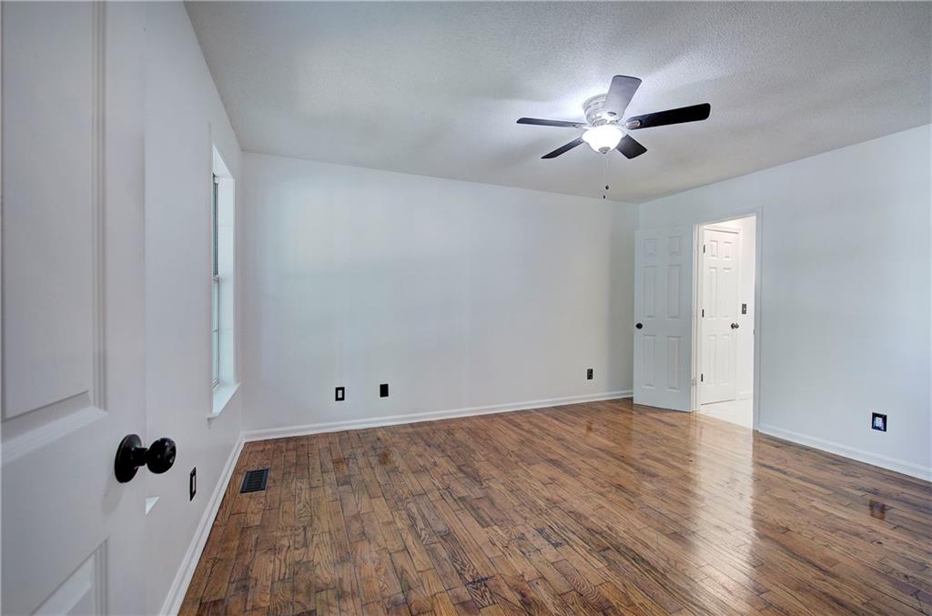 22 Nottingham Drive Northwest Cartersville, GA 30121 - Photo 18 of 36 a view of an empty room with wooden floor