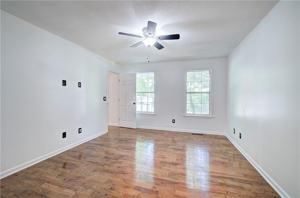 22 Nottingham Drive Northwest Cartersville, GA 30121 - Photo 20 of 36 wooden floor in an empty room with a window