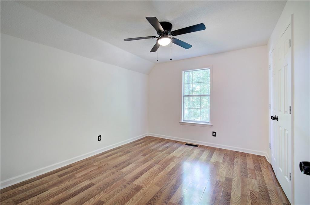 22 Nottingham Drive Northwest Cartersville, GA 30121 - Photo 25 of 36 an empty room with wooden floor and windows