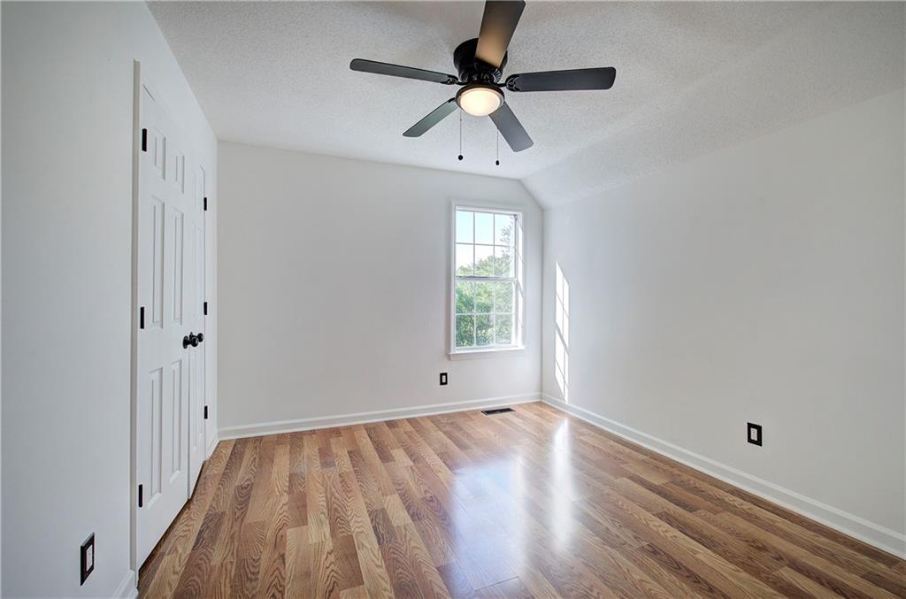 22 Nottingham Drive Northwest Cartersville, GA 30121 - Photo 27 of 36 wooden floor in an empty room with a window