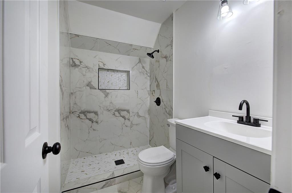 22 Nottingham Drive Northwest Cartersville, GA 30121 - Photo 29 of 36 a bathroom with a sink toilet and shower