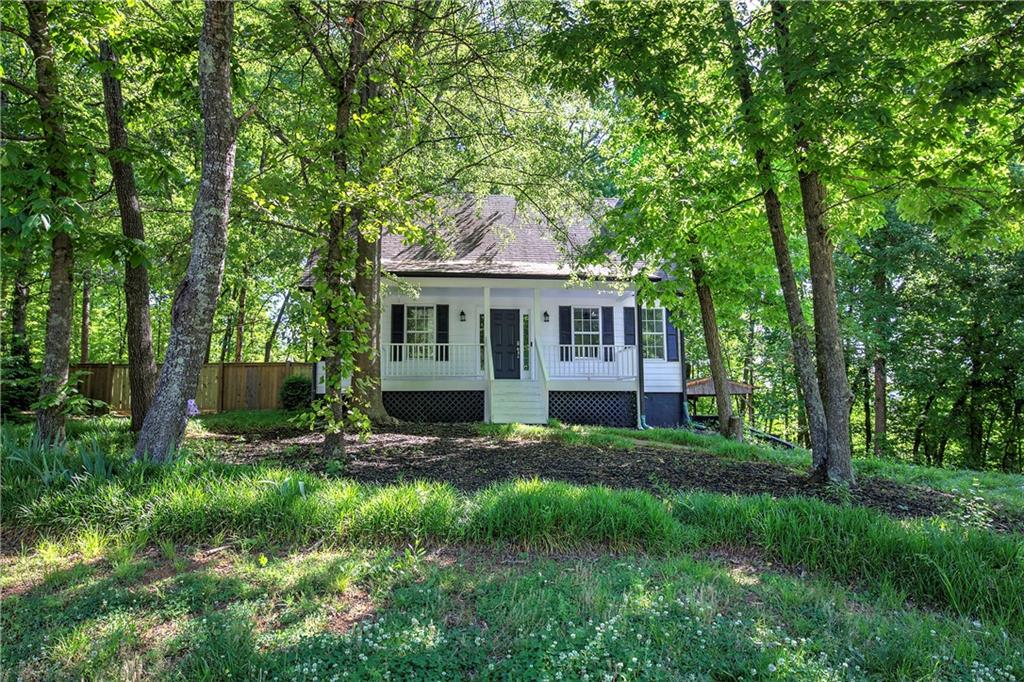 22 Nottingham Drive Northwest Cartersville, GA 30121 - Photo 3 of 36 a view of a house with a yard and sitting area