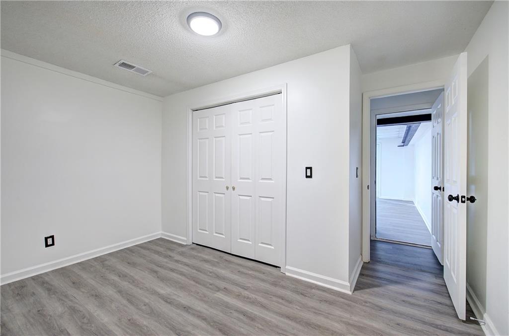 22 Nottingham Drive Northwest Cartersville, GA 30121 - Photo 31 of 36 a view of a hallway with wooden floor