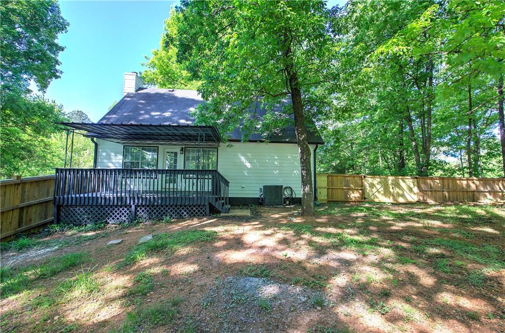 22 Nottingham Drive Northwest Cartersville, GA 30121 - Photo 35 of 36 a view of a small yard and wooden fence