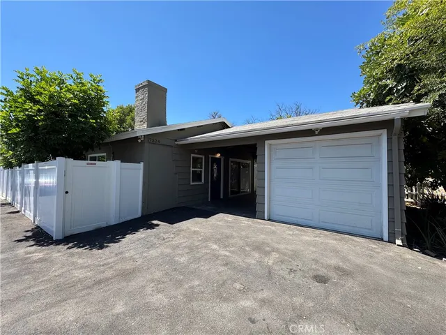 a front view of a house with a garage