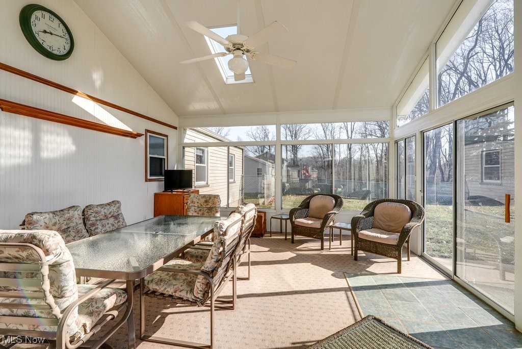 4220 Lake Heights Road Northwest Canton, OH 44708 - Photo 19 of 48 Sunroom featuring vaulted ceiling, plenty of natural light, and ceiling fan