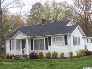 182 Weisner Road Olin, NC 28660 - Photo 1 of 10 a view of a house with a yard and plants
