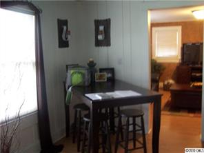 182 Weisner Road Olin, NC 28660 - Photo 3 of 10 a view of a workspace with furniture