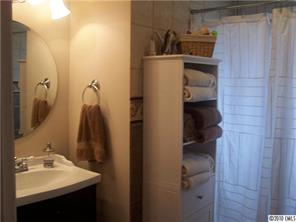 182 Weisner Road Olin, NC 28660 - Photo 4 of 10 a bathroom with a sink and mirror