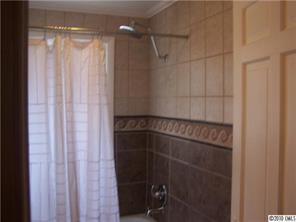 182 Weisner Road Olin, NC 28660 - Photo 5 of 10 a bathroom with a glass shower door